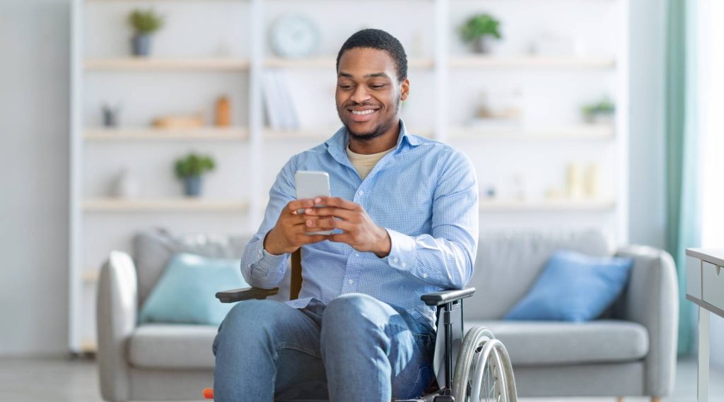 Man-in-wheelchair-using-smartphone-1024x569